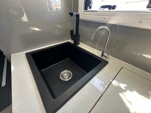 Sink with blackhardware in Paramount Tuff Mudda