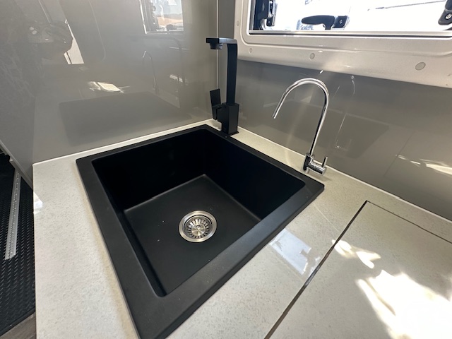 Sink with blackhardware in Paramount Tuff Mudda