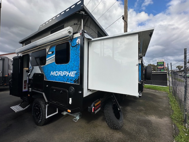 13’ Xseries Morphe pop top and fold out exterior|13’ Xseries Morphe slide out stove|13’ Xseries Morphe exterior front|13’ Xseries Morphe exterior compartment|13’ Xseries Morphe compartment with stereo and plugs|13’ Xseries Morphe slide out for BBQ|13’ Xseries Morphe external storage|13’ Xseries Morphe exterior|13’ Xseries Morphe exterior compartment|13’ Xseries Morphe living area|13’ Xseries Morphe sitting area|13’ Xseries Morphe electronic cabinet|13’ Xseries Morphe double bed|13’ Xseries Morphe bench and cupboards|13’ Xseries Morphe kitchen|13’ Xseries Morphe bathroom|13’ Xseries Morphe fridge and pantry|13’ Xseries Morphe kitchen|13’ Xseries Morphe bench with pantry|13’ Xseries Morphe bench with pantry|13’ Xseries Morphe wall fan|13’ Xseries Morphe double bed|13’ Xseries Morphe living area|13’ Xseries Morphe mounted TV|13’ Xseries Morphe living area